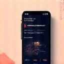 Smartphone screen displaying a modern wellness app interface with tracking features, alongside other tech gadgets.